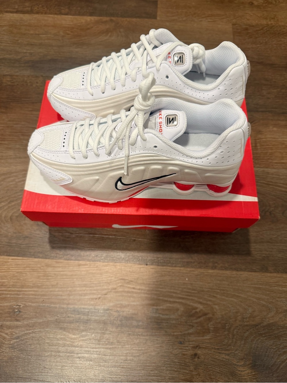 Nike Kids White Sneakers with Black Swoosh